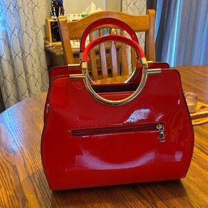 Chic Red Patent Leather Satchel with Gold Accents